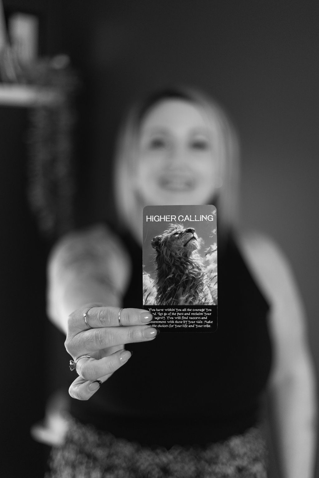 Rose holding out a Higher Calling oracle card