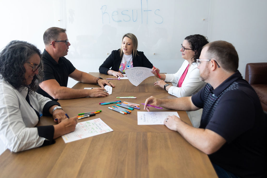 Rose Dalrymple leading a working session around a boardroom table